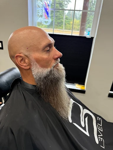 Client with a styled long beard after grooming service